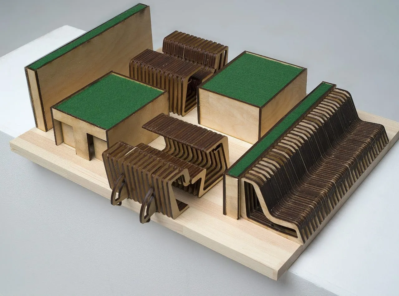 Scale model of the module with benches, tables and green roof sections